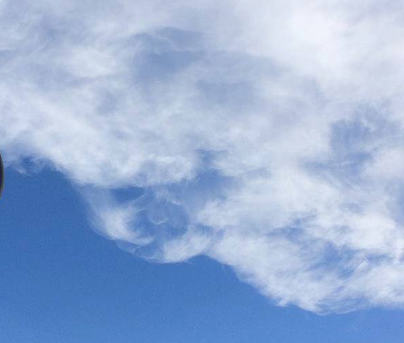 round face in a cloud